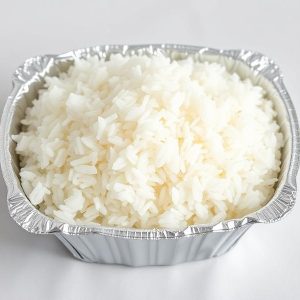Aluminum takeout container filled with fluffy white rice.